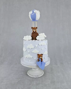Fanciful Light Blue Tall Birthday Cake with Bear, Air Balloon, and Cloud Decorations Enchanting Light Blue Tall Birthday Cake with Bear, Air Balloon, and Cloud Decorations