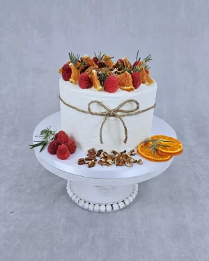 Single Tier Cake Designed with Raspberry, Pecan, Oranges Delicious Single Tier Cake with Raspberry, Pecan, and Oranges